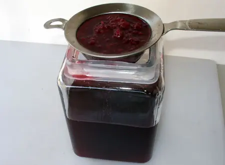 Straining the Blackberry Liqueur